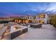 Beautiful backyard featuring a pool, fire pit, and comfortable seating, ideal for relaxation and entertainment at 12 Olympia Chase Dr, Las Vegas, NV 89141