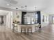 Chic bar area with a sleek countertop, stylish pendant lights, and seating for four at 12 Olympia Chase Dr, Las Vegas, NV 89141