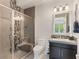 Contemporary bathroom featuring a glass shower, toilet, and vanity with modern fixtures at 12 Olympia Chase Dr, Las Vegas, NV 89141