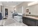 Modern bathroom with dual vanities, a soaking tub, and stylish mosaic tile accents at 12 Olympia Chase Dr, Las Vegas, NV 89141