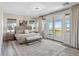 Bright bedroom with floor-to-ceiling curtains and doors leading to outdoor balcony and natural light at 12 Olympia Chase Dr, Las Vegas, NV 89141