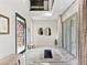 Welcoming entryway with marble floors, neutral tones, and unique decorative mirrors at 12 Olympia Chase Dr, Las Vegas, NV 89141