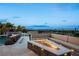 Inviting outdoor space featuring a modern fire pit and a comfortable built-in seating area at 12 Olympia Chase Dr, Las Vegas, NV 89141