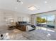 Serene main bedroom featuring a plush bed, neutral decor, and access to the outdoor area at 12 Olympia Chase Dr, Las Vegas, NV 89141
