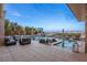 Backyard featuring a luxurious pool, comfortable lounge area, and mature landscaping at 12 Olympia Chase Dr, Las Vegas, NV 89141