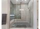 Modern bathroom featuring a glass enclosed shower with mosaic tile surround and built in bench at 12 Olympia Chase Dr, Las Vegas, NV 89141
