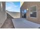 View of the backyard area featuring a concrete patio and block wall at 1203 Sweet Orange St, Las Vegas, NV 89142