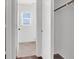 Hallway view leading to a bathroom with tile flooring and open closet at 1203 Sweet Orange St, Las Vegas, NV 89142
