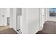 Hallway featuring an in-unit washer and dryer behind sliding doors at 1203 Sweet Orange St, Las Vegas, NV 89142
