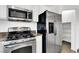 Appliances included: Stainless steel refrigerator, oven, and microwave at 1203 Sweet Orange St, Las Vegas, NV 89142