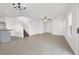 Open-concept living space with tile flooring, ceiling fan, and natural light at 1203 Sweet Orange St, Las Vegas, NV 89142