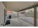 Backyard patio features a covered area with interlocking brick pavers and desert landscaping at 1404 Dragon Rock Dr, Henderson, NV 89052