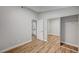 A bright bedroom featuring hardwood floors, ensuite bathroom and closet at 1404 Dragon Rock Dr, Henderson, NV 89052