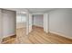 Bedroom featuring wood floors, closet with mirrored doors, and natural light at 1404 Dragon Rock Dr, Henderson, NV 89052