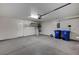 Garage with epoxy floors, storage racks, and garage door opener at 1404 Dragon Rock Dr, Henderson, NV 89052
