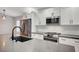 Modern kitchen featuring stainless steel appliances, white cabinets, and gray countertops at 1404 Dragon Rock Dr, Henderson, NV 89052