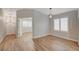 Bright living room with wood-look floors and plantation shutters at 1404 Dragon Rock Dr, Henderson, NV 89052