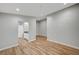 A spacious living room featuring modern wood flooring and recessed lighting at 1404 Dragon Rock Dr, Henderson, NV 89052