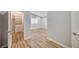 Primary bedroom with a walk-in closet and wood-style floors at 1404 Dragon Rock Dr, Henderson, NV 89052
