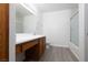 Bathroom featuring a wood vanity, ample countertop space, and a shower at 1450 Jamielinn Ln # 201, Las Vegas, NV 89110