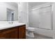 Bathroom featuring a vanity sink, toilet, and a shower with sliding glass doors at 1450 Jamielinn Ln # 201, Las Vegas, NV 89110