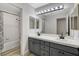 Bathroom with double vanity, tub and shower at 1700 Wandering Winds Way, Las Vegas, NV 89128
