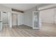Bright bedroom featuring wood-look flooring, closet, and natural light at 1700 Wandering Winds Way, Las Vegas, NV 89128