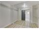 Walk-in closet featuring mirrored sliding doors, wire shelving, and modern flooring at 1700 Wandering Winds Way, Las Vegas, NV 89128