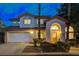 Well-maintained two-story home with an attached two-car garage and inviting front entrance at 1700 Wandering Winds Way, Las Vegas, NV 89128