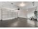 Attached two car garage featuring high ceilings, and a water heater at 1700 Wandering Winds Way, Las Vegas, NV 89128