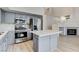 Well-equipped kitchen with gray cabinets, a center island, and stainless steel appliances at 1700 Wandering Winds Way, Las Vegas, NV 89128