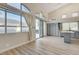 Inviting kitchen with gray cabinets, stainless appliances, and lots of natural light from expansive windows at 1700 Wandering Winds Way, Las Vegas, NV 89128