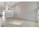 Spacious, sunlit living area featuring high ceilings, a modern chandelier and wood-style flooring at 1700 Wandering Winds Way, Las Vegas, NV 89128