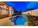 Stunning pool with tiled accents and ample space for relaxing and enjoying the outdoors at 1700 Wandering Winds Way, Las Vegas, NV 89128