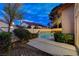 This backyard features a pool, mature landscaping and an outdoor oasis for relaxing and entertaining at 1700 Wandering Winds Way, Las Vegas, NV 89128