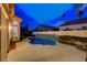 Inviting backyard with a sparkling pool featuring a tiled water feature for relaxation at 1700 Wandering Winds Way, Las Vegas, NV 89128