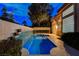 Beautiful pool with tiled water feature, perfect for relaxation and enjoying outdoor living at 1700 Wandering Winds Way, Las Vegas, NV 89128
