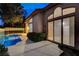 Enjoy the outdoors with this pool and covered patio with views of the backyard and landscaping at 1700 Wandering Winds Way, Las Vegas, NV 89128