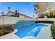 Backyard pool with waterfall feature amidst lush greenery provides a calming outdoor experience at 1700 Wandering Winds Way, Las Vegas, NV 89128