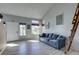 Bright living room with many windows and luxury vinyl flooring at 182 Cantamar St, Henderson, NV 89074