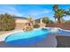 Beautiful pool with a rock waterfall feature and integrated spa in a private backyard setting at 1831 Cavendish Way, Henderson, NV 89012