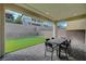 Cozy outdoor space with a putting green and a patio set for entertaining at 195 Cactus Sunrise St, Las Vegas, NV 89138