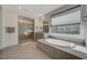 Bright bathroom featuring a soaking tub and a tiled walk-in shower at 195 Cactus Sunrise St, Las Vegas, NV 89138