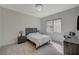 Contemporary bedroom with a sleek bed frame, carpeted floors, modern lighting, and a window view at 195 Cactus Sunrise St, Las Vegas, NV 89138