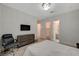 Spacious bedroom with a television, comfortable chair, and a luxurious Primary bathroom nearby at 195 Cactus Sunrise St, Las Vegas, NV 89138