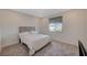 Bright bedroom featuring a comfortable bed and a large window, creating a peaceful retreat at 195 Cactus Sunrise St, Las Vegas, NV 89138