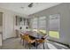 Elegant dining area featuring a modern light fixture and views of the backyard at 195 Cactus Sunrise St, Las Vegas, NV 89138