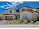 Beautiful two-story home with a two-car garage and desert landscaping at 195 Cactus Sunrise St, Las Vegas, NV 89138