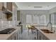 Contemporary kitchen with stainless steel appliances, gray cabinets, and an island with a sink at 195 Cactus Sunrise St, Las Vegas, NV 89138