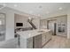 Open concept kitchen with stainless steel appliances and view of staircase and living room at 195 Cactus Sunrise St, Las Vegas, NV 89138